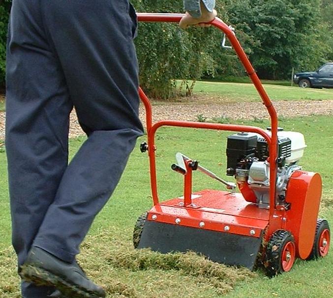 man using lawn mower